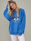 <img ="Evil Eye_Sweatshirt.png" alt="Evil Eye Sweatshirt Overzised Blue Color gold sequences"