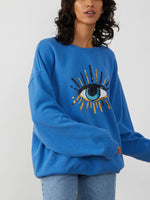<img ="Evil Eye_Sweatshirt.png" alt="Evil Eye Sweatshirt Overzised Blue Color gold sequences"